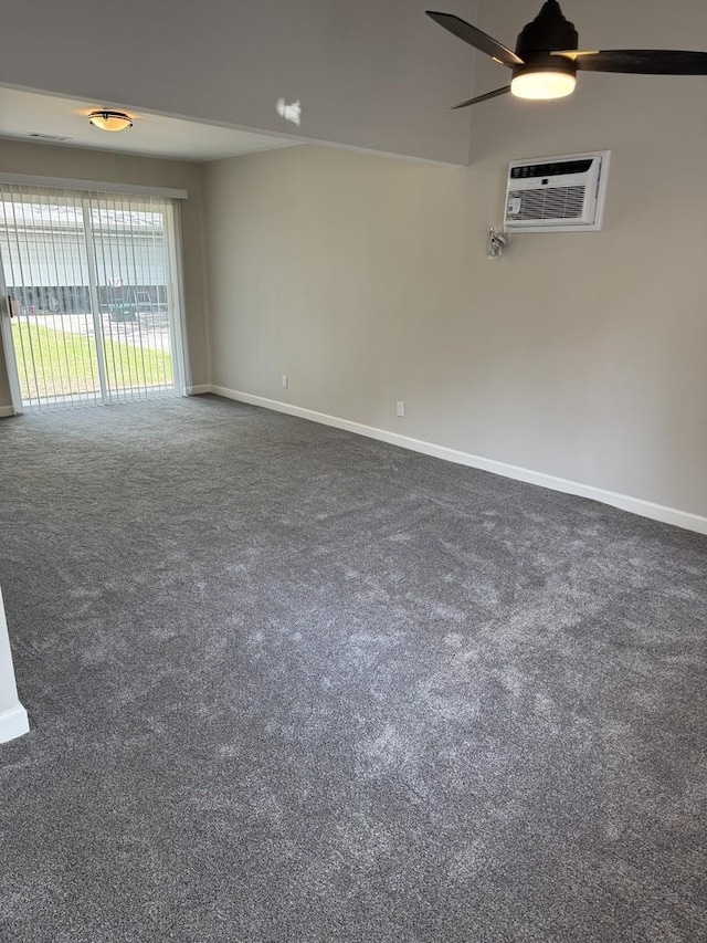 2407 Burbank St, Joliet, IL 60435 - empty room featuring dark carpet, baseboards, a ceiling fan, and a wall unit AC