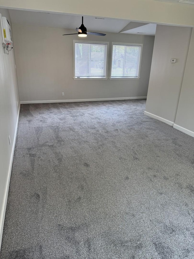 2407 Burbank St, Joliet, IL 60435 - empty room featuring carpet floors, a ceiling fan, and baseboards
