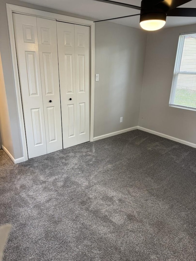 2407 Burbank St, Joliet, IL 60435 - unfurnished bedroom with carpet floors, baseboards, ceiling fan, and a closet