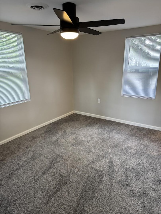 2407 Burbank St, Joliet, IL 60435 - unfurnished room featuring ceiling fan, plenty of natural light, and baseboards