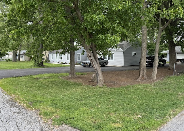2407 Burbank St, Joliet, IL 60435 - view of front of property with driveway, a front yard, and a residential view