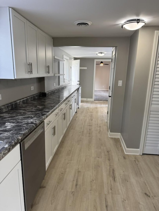 2407 Burbank St, Joliet, IL 60435 - kitchen featuring stainless steel dishwasher, ceiling fan, light wood-type flooring, white cabinets, and baseboards