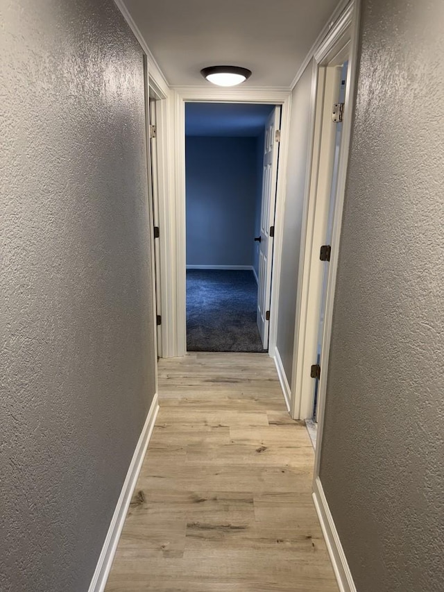 2407 Burbank St, Joliet, IL 60435 - hallway featuring a textured wall, light wood-style floors, and baseboards