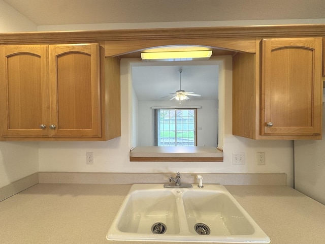 350 Centerpoint Dr N, Bourbonnais, IL 60914 - kitchen featuring light countertops, a sink, ceiling fan, and brown cabinets