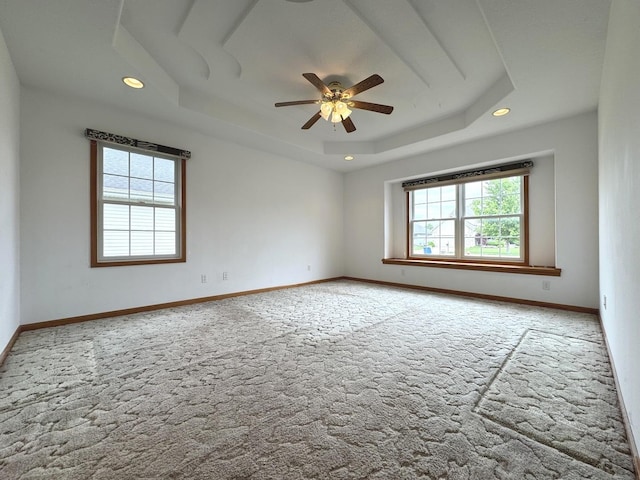 350 Centerpoint Dr N, Bourbonnais, IL 60914 - spare room with carpet flooring, a raised ceiling, ceiling fan, recessed lighting, and baseboards