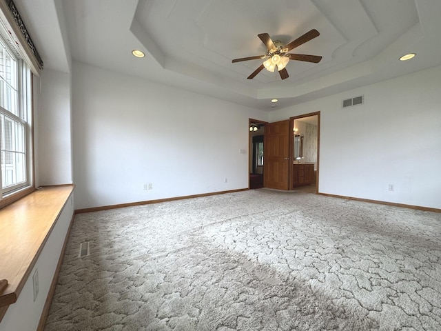 350 Centerpoint Dr N, Bourbonnais, IL 60914 - empty room with light carpet, a tray ceiling, ceiling fan, recessed lighting, and baseboards