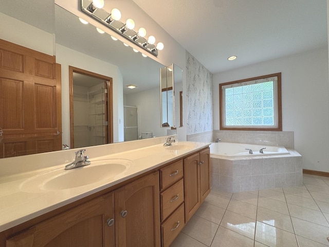 350 Centerpoint Dr N, Bourbonnais, IL 60914 - full bath with double vanity, a garden tub, tile patterned flooring, a stall shower, and a spacious closet