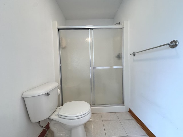 350 Centerpoint Dr N, Bourbonnais, IL 60914 - bathroom with a shower stall, toilet, tile patterned floors, and baseboards