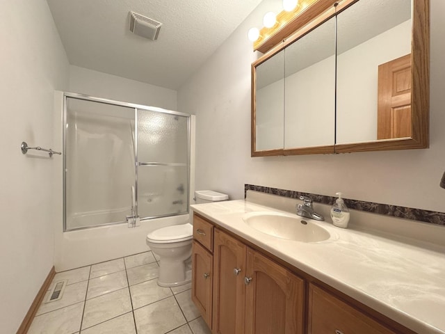 350 Centerpoint Dr N, Bourbonnais, IL 60914 - bathroom with vanity, toilet, shower / bath combination with glass door, and tile patterned floors