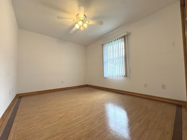 350 Centerpoint Dr N, Bourbonnais, IL 60914 - unfurnished room featuring wood finished floors, baseboards, and ceiling fan
