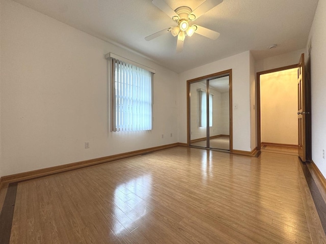 350 Centerpoint Dr N, Bourbonnais, IL 60914 - empty room featuring light wood finished floors, a ceiling fan, and baseboards