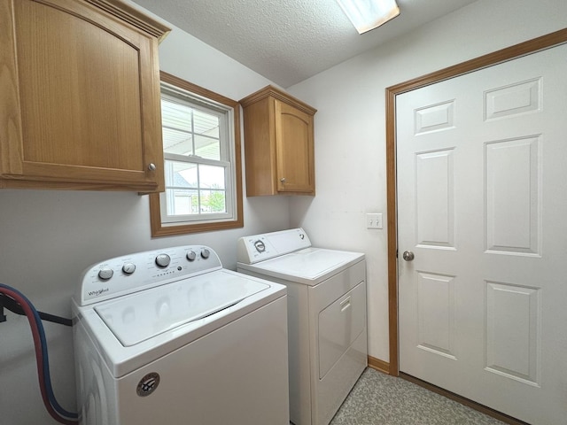 350 Centerpoint Dr N, Bourbonnais, IL 60914 - washroom with cabinet space, washing machine and clothes dryer, carpet, a textured ceiling, and baseboards