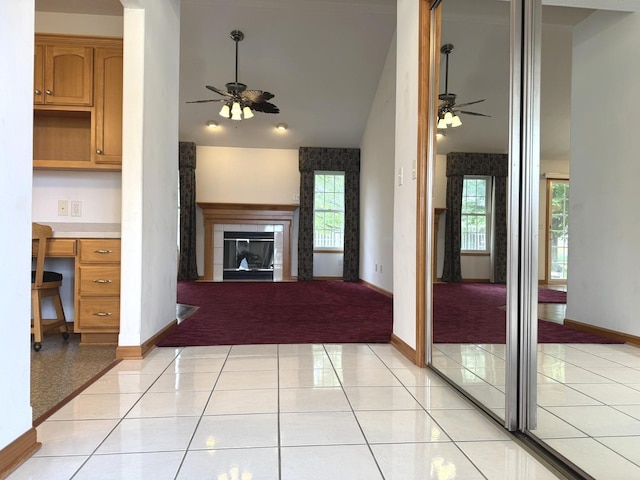 350 Centerpoint Dr N, Bourbonnais, IL 60914 - unfurnished living room with a ceiling fan, light carpet, a fireplace, baseboards, and vaulted ceiling