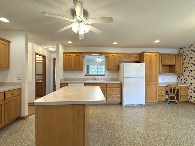 350 Centerpoint Dr N, Bourbonnais, IL 60914 - kitchen with white appliances, a sink, ceiling fan, baseboards, and light countertops