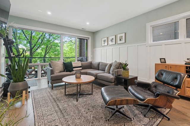 1110 N Marshfield Ave Unit 2, Chicago, IL 60622 - living area with wood finished floors, wainscoting, a decorative wall, and recessed lighting