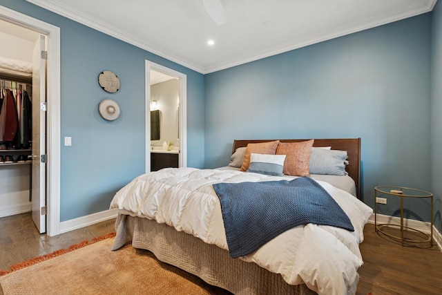 1110 N Marshfield Ave Unit 2, Chicago, IL 60622 - bedroom featuring a closet, a spacious closet, baseboards, wood finished floors, and ornamental molding