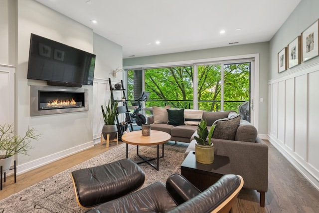 1110 N Marshfield Ave Unit 2, Chicago, IL 60622 - living area featuring a glass covered fireplace, wood finished floors, recessed lighting, and baseboards