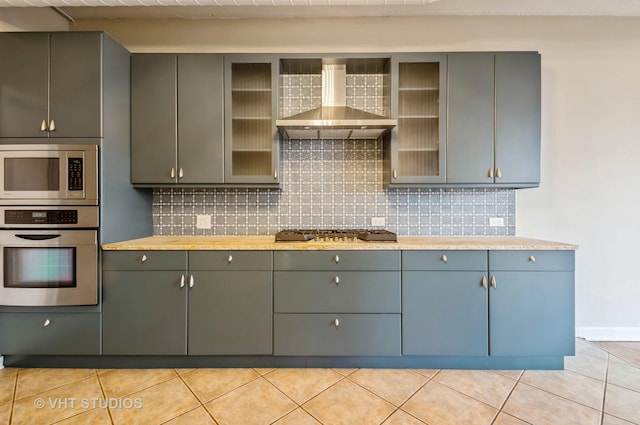 411 W Ontario St Unit 623, Chicago, IL 60654 - kitchen with stainless steel appliances, wall chimney exhaust hood, tasteful backsplash, and gray cabinets