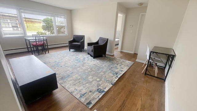 39 W Conti Pkwy Unit 2N, Elmwood Park, IL 60707 - living area with baseboard heating, wood finished floors, and baseboards