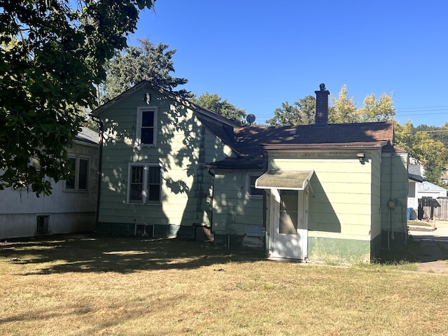 454 Ryall St, Marseilles, IL 61341 - back of property with a lawn and a chimney