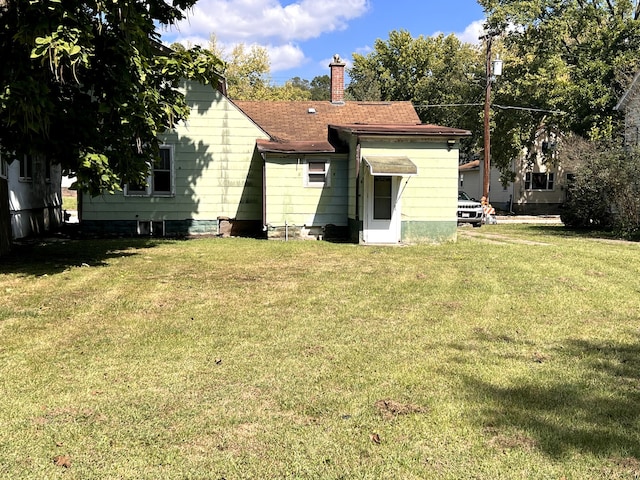 454 Ryall St, Marseilles, IL 61341 - back of house with a chimney and a yard