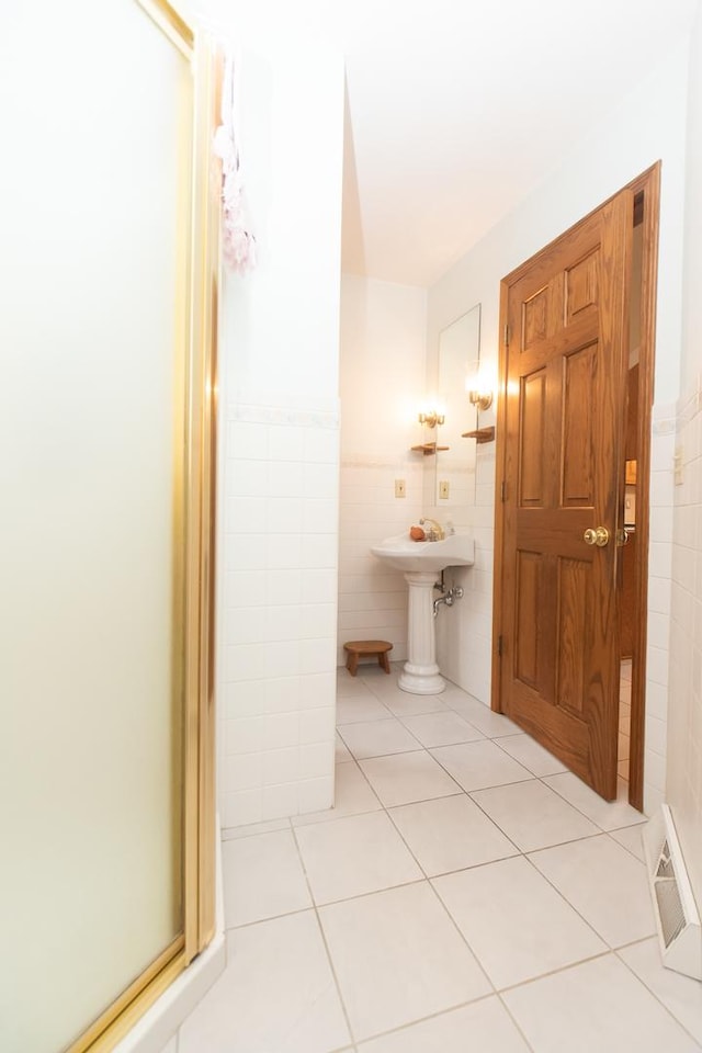 1131 Fourth Ave, Dixon, IL 61021 - bathroom featuring tile walls and tile patterned floors