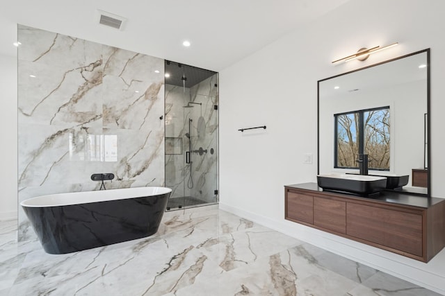 8833 Birch Ave, Morton Grove, IL 60053 - full bath with marble tiled floors, a marble finish shower, a freestanding tub, vanity, and recessed lighting