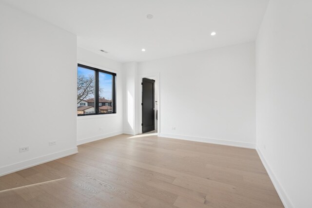 8833 Birch Ave, Morton Grove, IL 60053 - spare room featuring light wood finished floors, recessed lighting, and baseboards