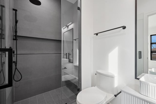 8833 Birch Ave, Morton Grove, IL 60053 - bathroom featuring a shower stall, toilet, and tile patterned floors
