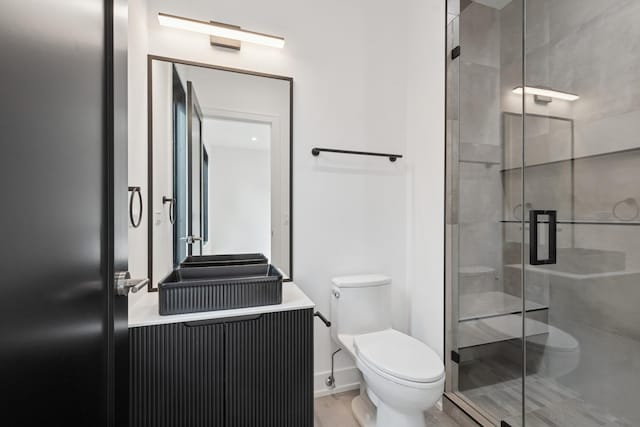 8833 Birch Ave, Morton Grove, IL 60053 - bathroom featuring toilet, a stall shower, and vanity