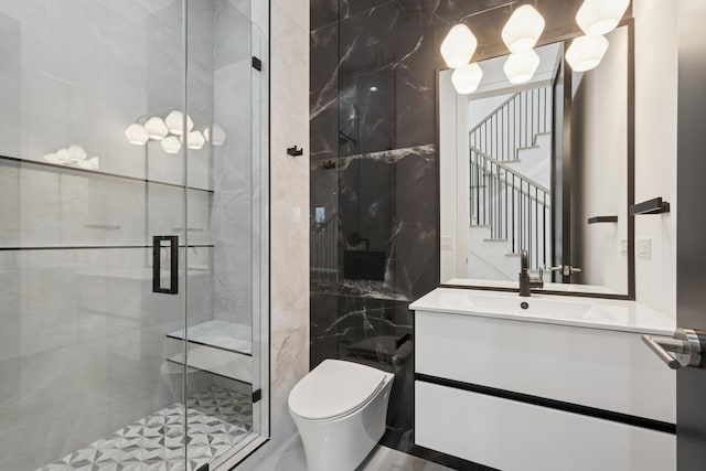 8833 Birch Ave, Morton Grove, IL 60053 - full bathroom with toilet, vanity, tile walls, and a marble finish shower