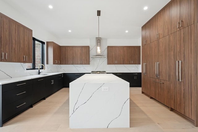 8833 Birch Ave, Morton Grove, IL 60053 - kitchen with wall chimney range hood, backsplash, recessed lighting, light wood-style flooring, and modern cabinets