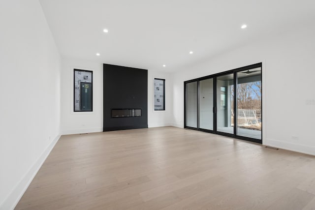 8833 Birch Ave, Morton Grove, IL 60053 - unfurnished living room with light wood finished floors, recessed lighting, baseboards, and a fireplace