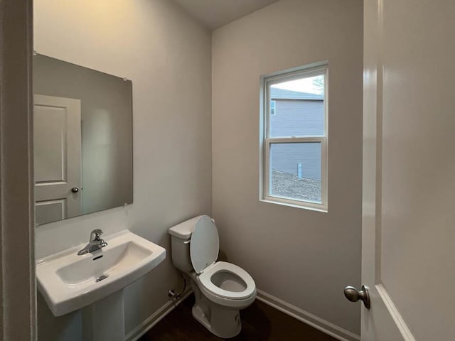 1025 Leeward Ln, Pingree Grove, IL 60140 - half bathroom with toilet, a sink, and baseboards