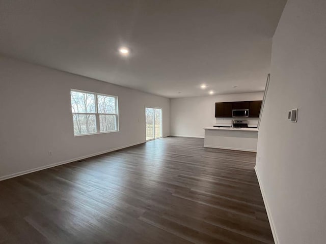 1025 Leeward Ln, Pingree Grove, IL 60140 - unfurnished living room with recessed lighting, dark wood finished floors, and baseboards