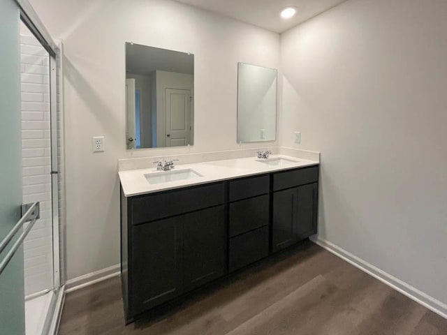 1025 Leeward Ln, Pingree Grove, IL 60140 - full bathroom with wood finished floors, double vanity, and baseboards