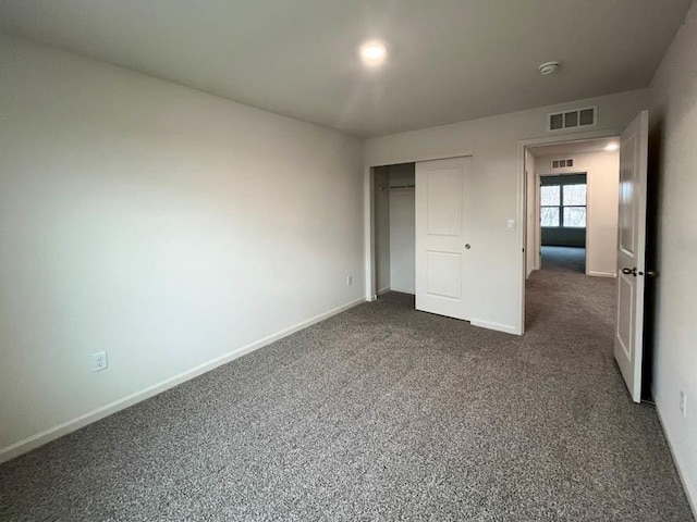 1025 Leeward Ln, Pingree Grove, IL 60140 - unfurnished bedroom with dark carpet, baseboards, and a closet