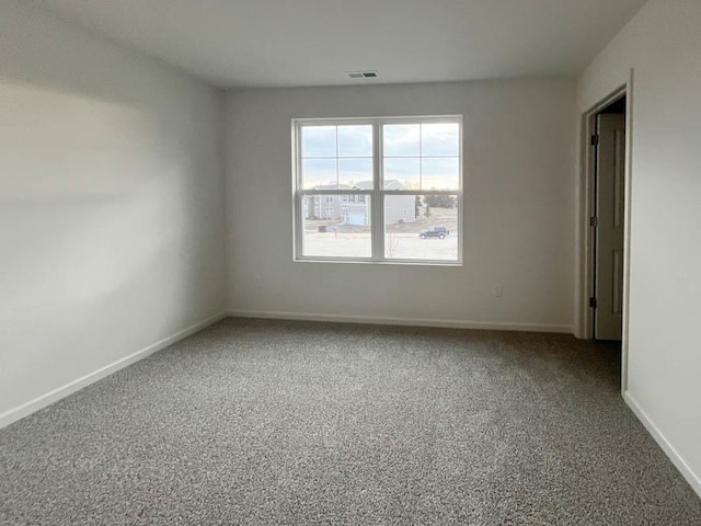 1025 Leeward Ln, Pingree Grove, IL 60140 - spare room featuring carpet and baseboards