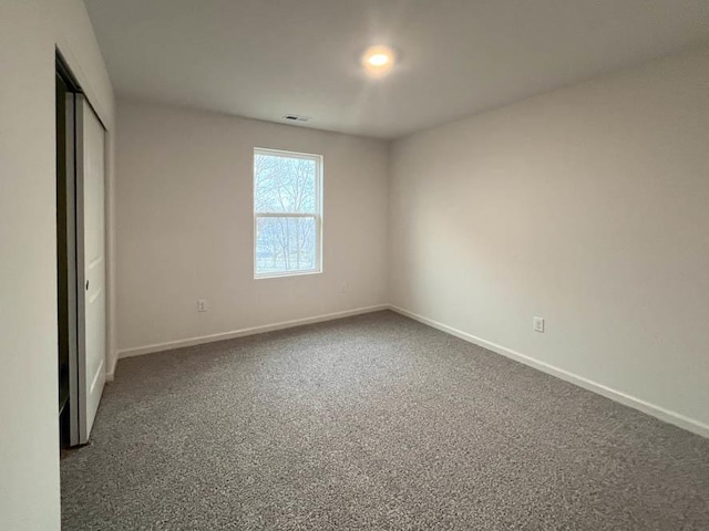 1025 Leeward Ln, Pingree Grove, IL 60140 - unfurnished bedroom featuring baseboards, carpet flooring, and a closet