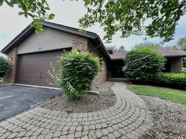807 Violet Ln, Matteson, IL 60443 - ranch-style home featuring brick siding, driveway, and a garage