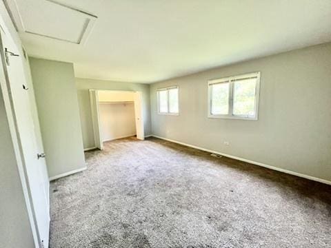 807 Violet Ln, Matteson, IL 60443 - unfurnished bedroom featuring baseboards, carpet floors, and attic access