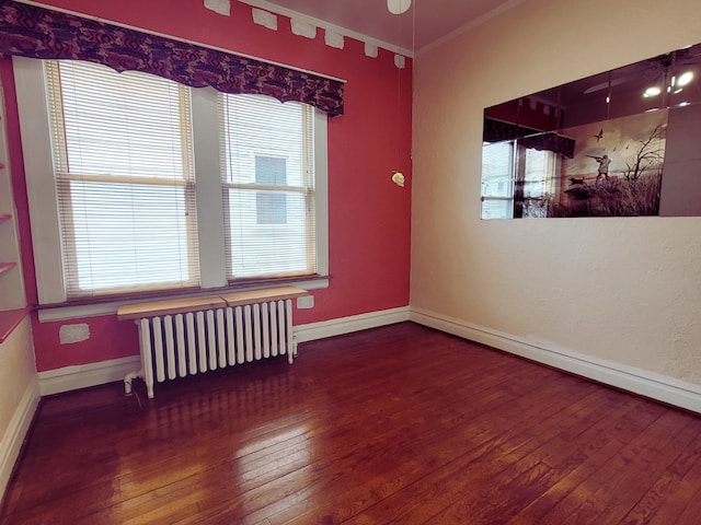 318 W 112th St, Chicago, IL 60628 - spare room with radiator heating unit, hardwood / wood-style flooring, crown molding, and baseboards