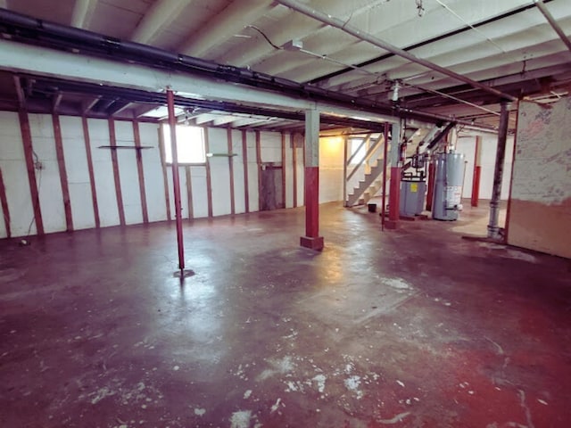 318 W 112th St, Chicago, IL 60628 - below grade area featuring water heater and stairway
