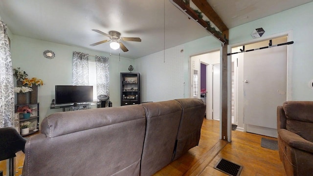 213 Arcadia Dr, Champaign, IL 61820 - living area featuring a ceiling fan, light wood finished floors, and a barn door