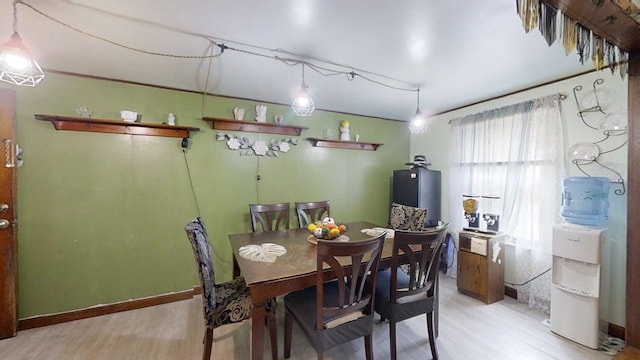 213 Arcadia Dr, Champaign, IL 61820 - dining room with light wood finished floors and water heater