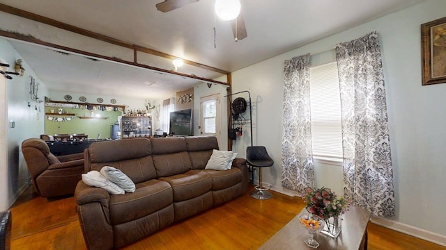 213 Arcadia Dr, Champaign, IL 61820 - living area with wood finished floors, ceiling fan, and baseboards