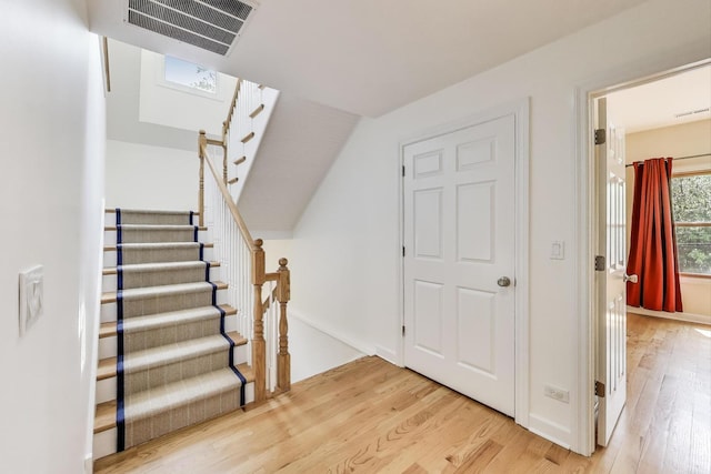 2430 Hastings Ave, Evanston, IL 60201 - staircase with wood finished floors and lofted ceiling