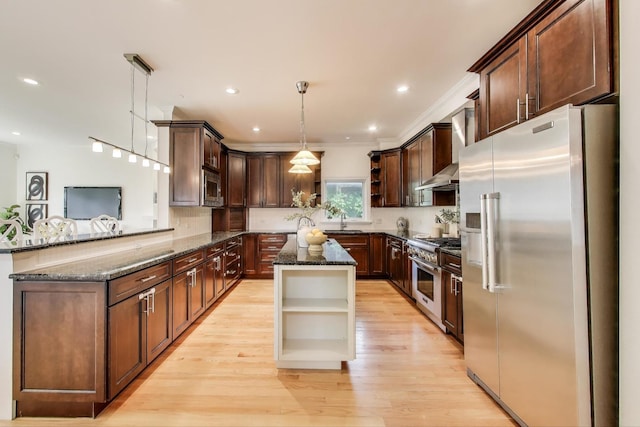 2430 Hastings Ave, Evanston, IL 60201 - kitchen featuring open shelves, premium appliances, dark stone countertops, wall chimney exhaust hood, and recessed lighting