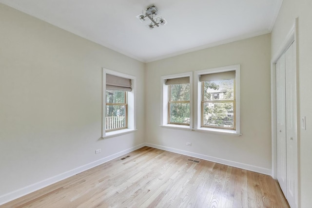 2430 Hastings Ave, Evanston, IL 60201 - unfurnished bedroom featuring light wood-style floors and a closet
