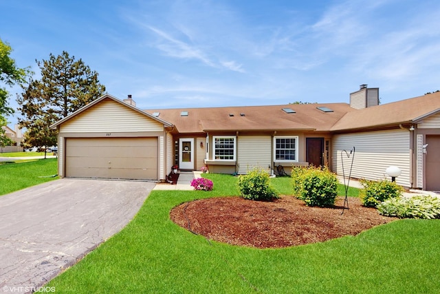267 Juniper Cir, Streamwood, IL 60107 - single story home featuring an attached garage, concrete driveway, a front yard, and a chimney